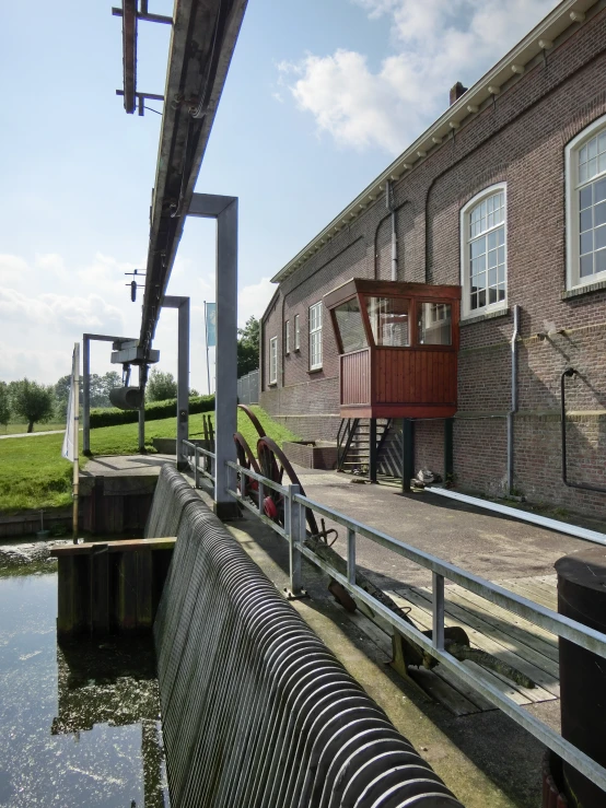 the water near a dock where three benches are located