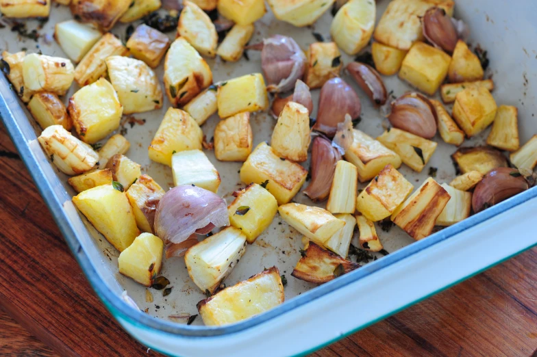 potatoes and other vegetables are sitting in the oven