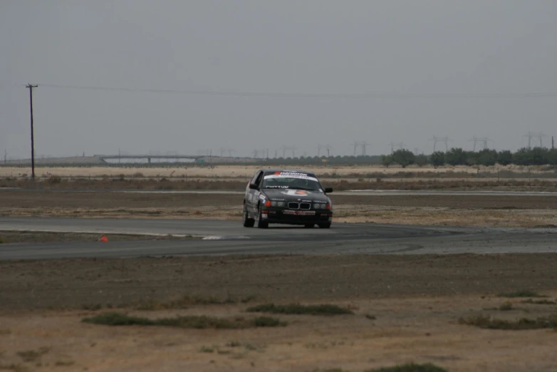 an automobile driving on an airport runway