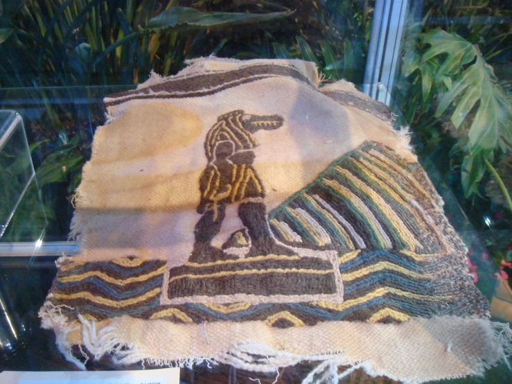 native embroidered cloth display in a store window