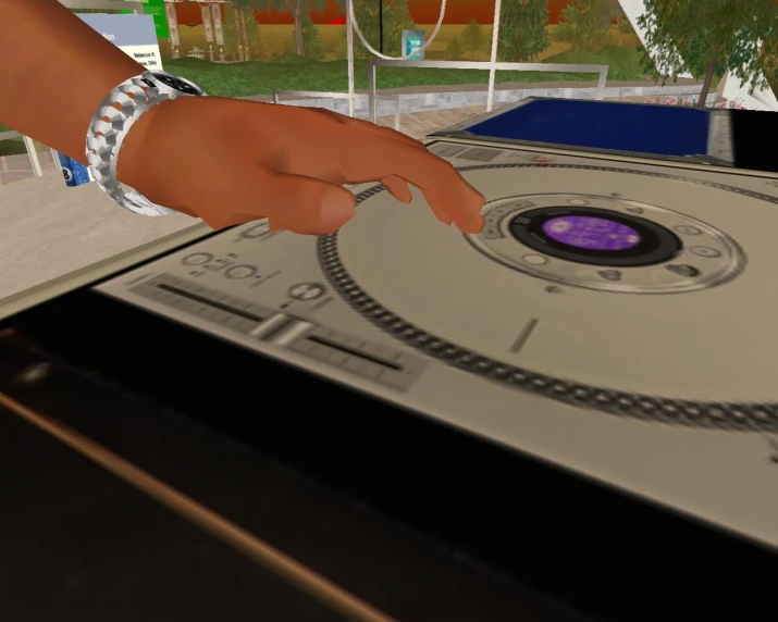 someone touching the disk on a turntable with a big ring on top