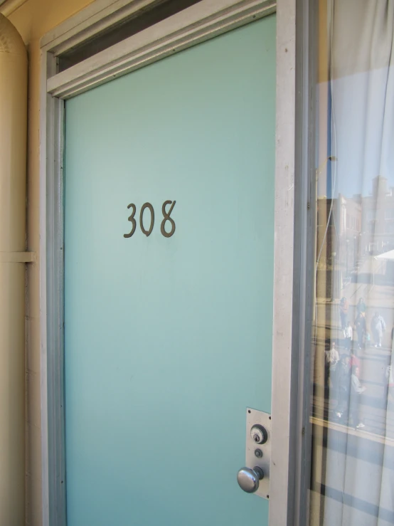 this is a close up view of a door that says'208 '