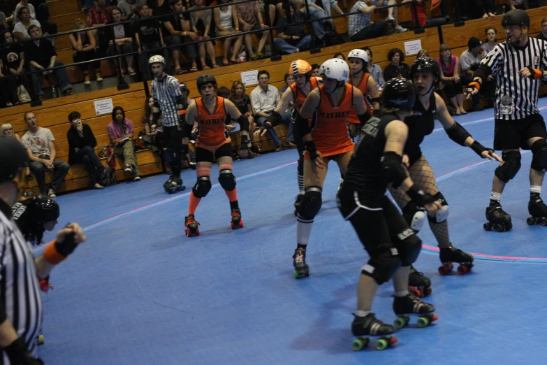 a group of people on roller skates in a game