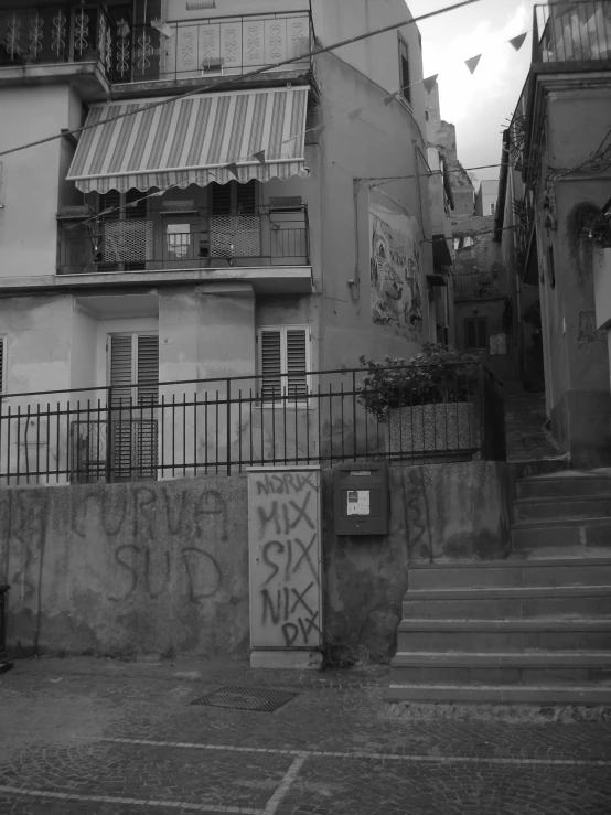 black and white pograph of a building with graffiti