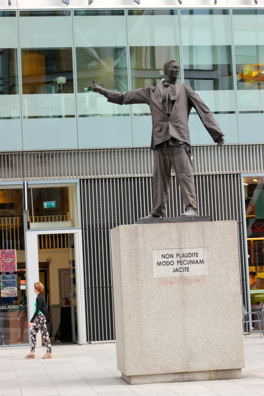 there is a statue of a man on display in the street