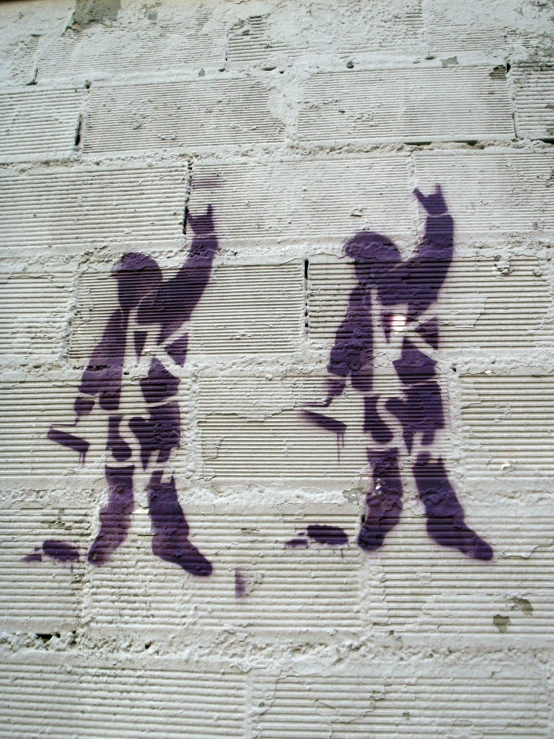 shadow of two people on wall with one man holding a bat