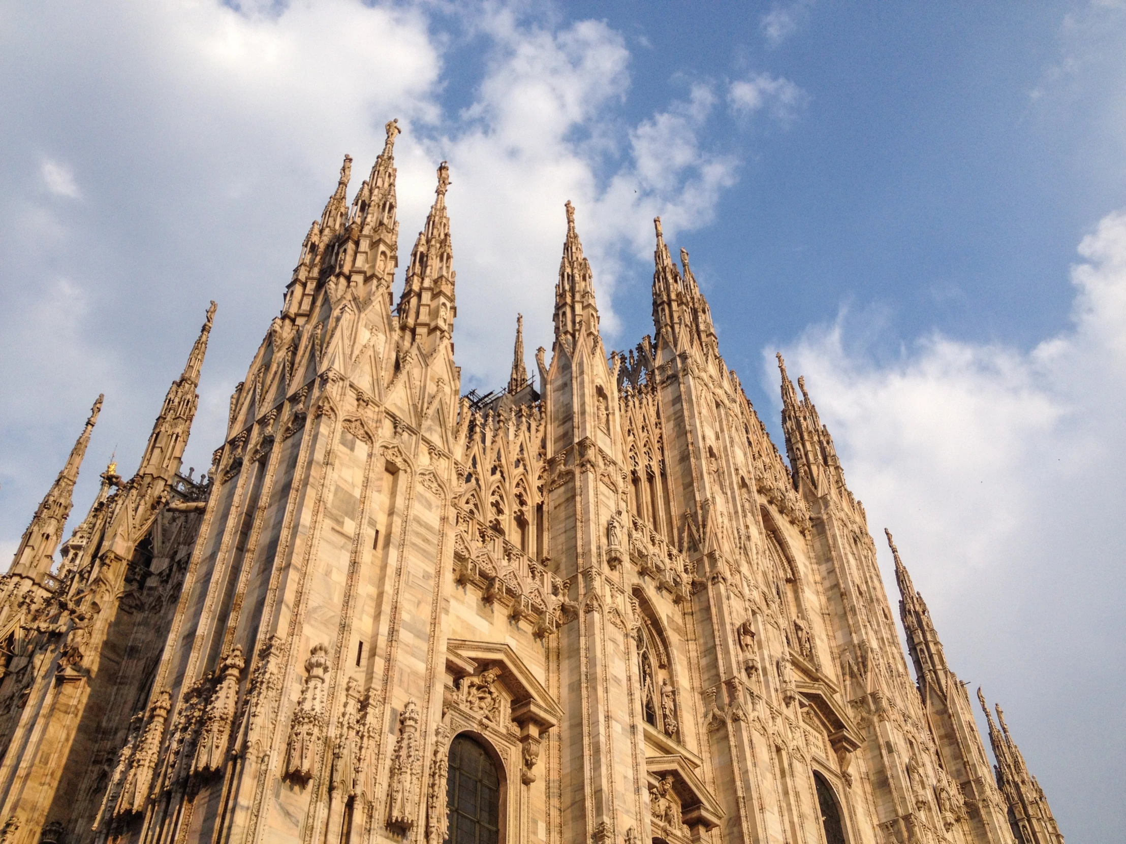 there is an upward view of a tall tower