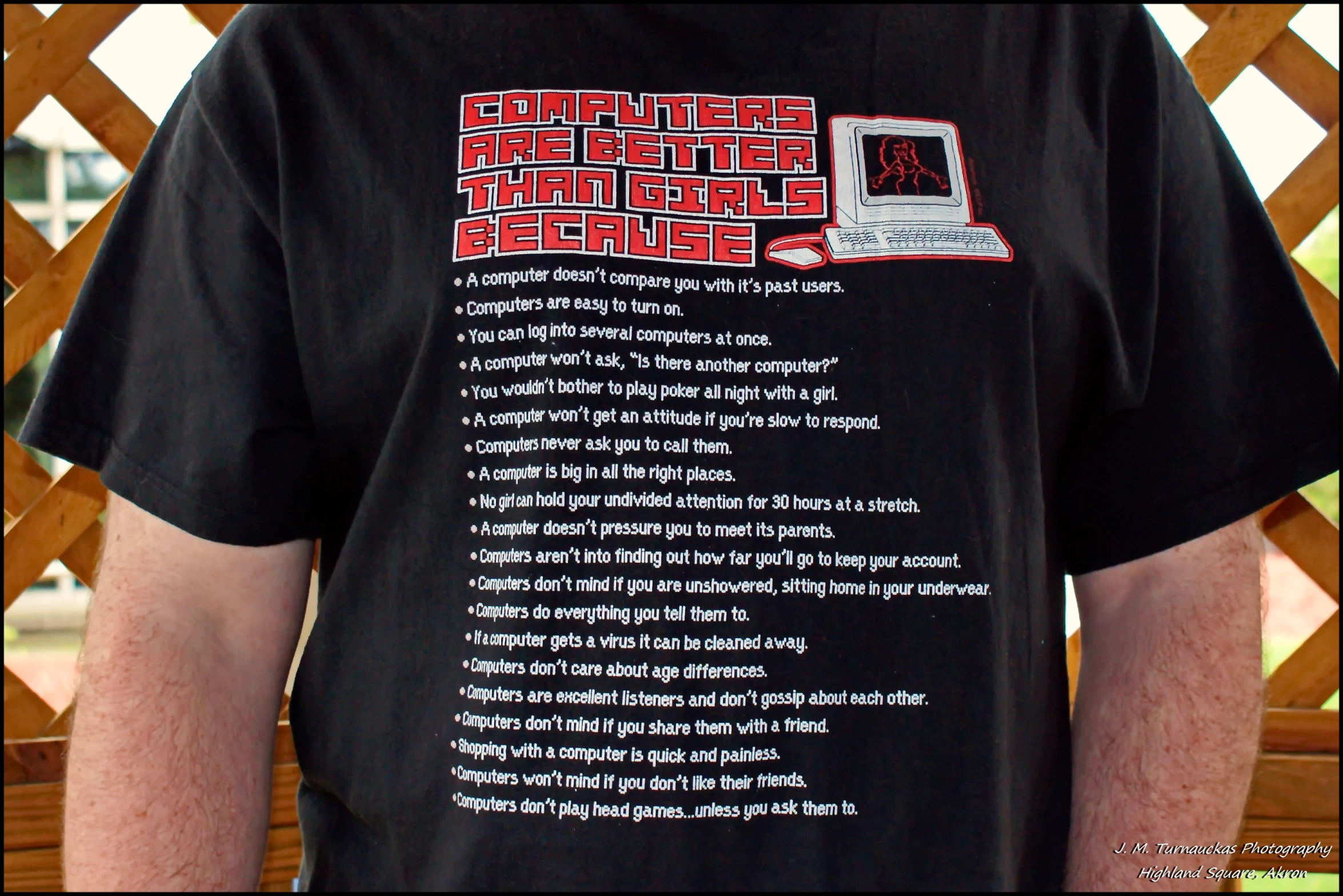 a person wearing a t shirt that has an old computer on it