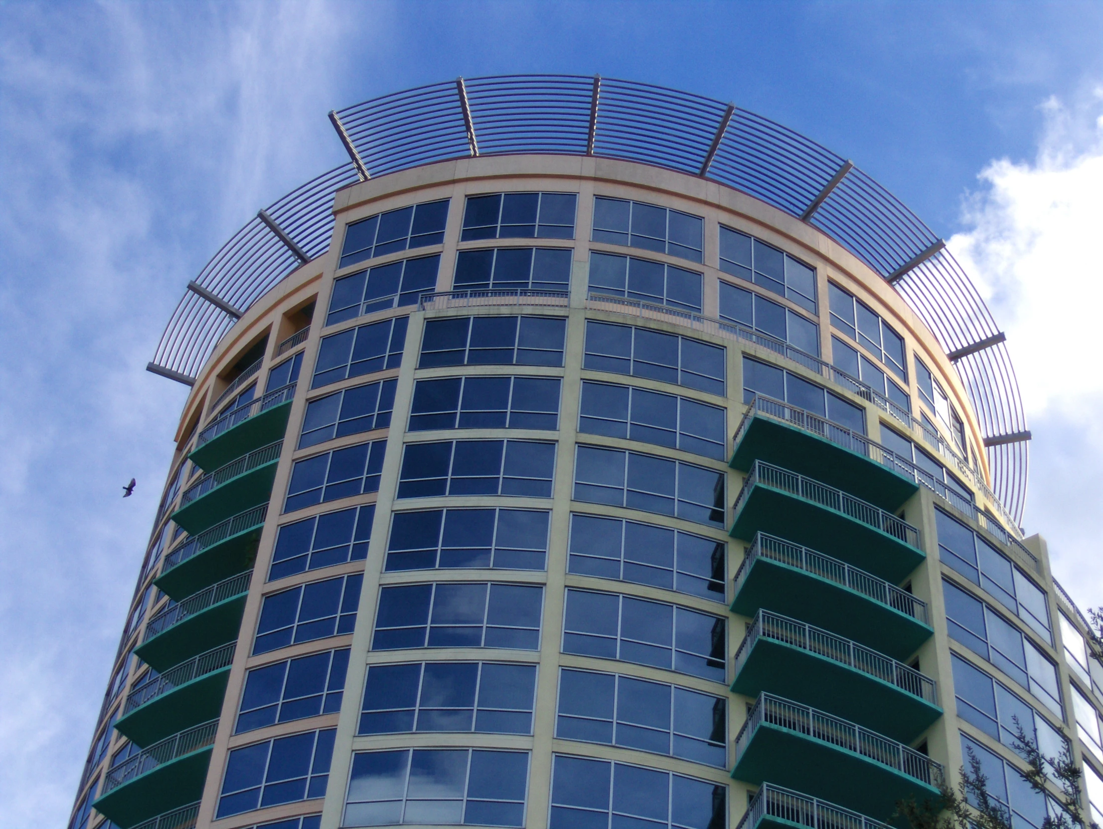 a building with windows on the side and the sky above