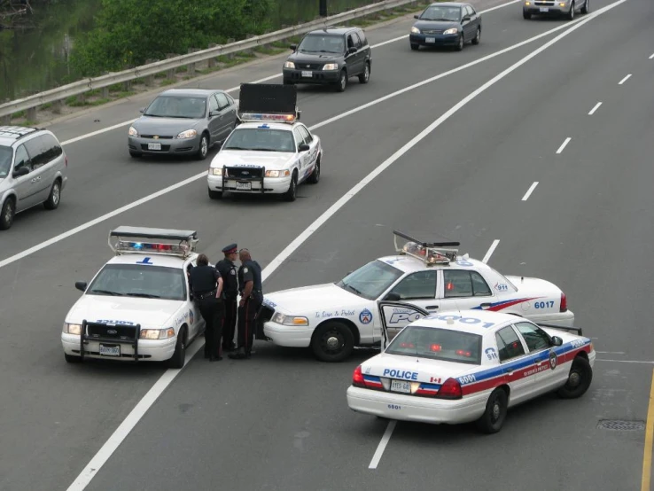 police and fire engines driving down a highway