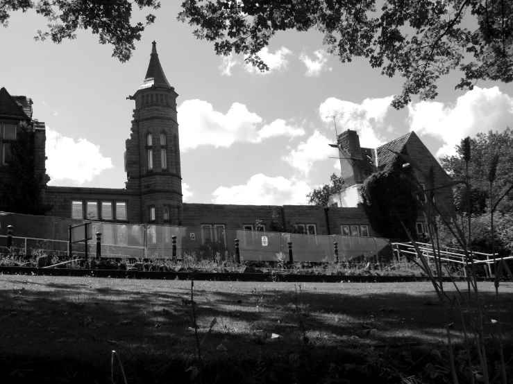 black and white po of a building with a clock on it