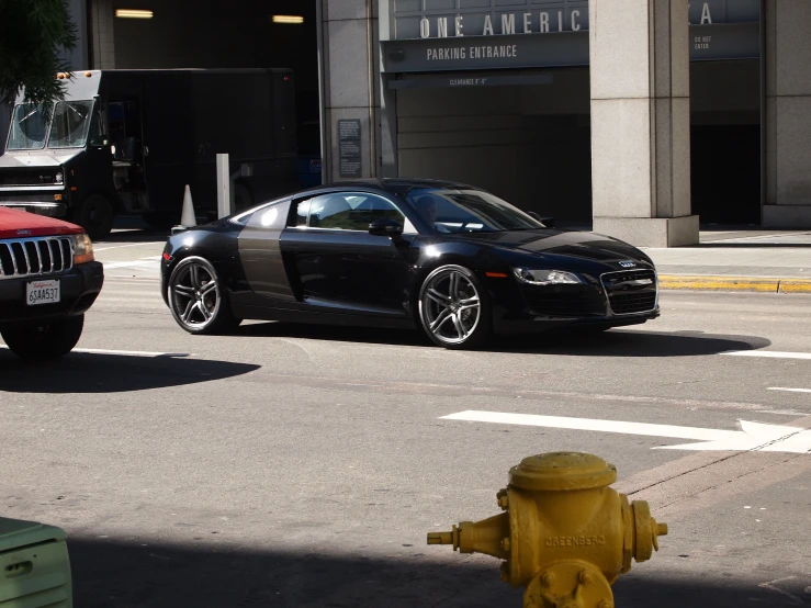 a black car parked on the side of the road