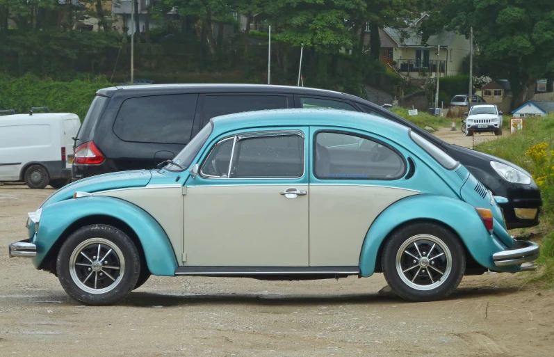 a volkswagen coupe from the movie beetle's knees in the parking lot