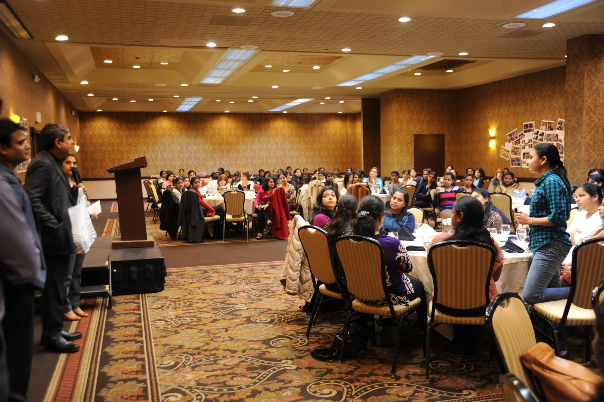 a very large crowd of people are at a conference