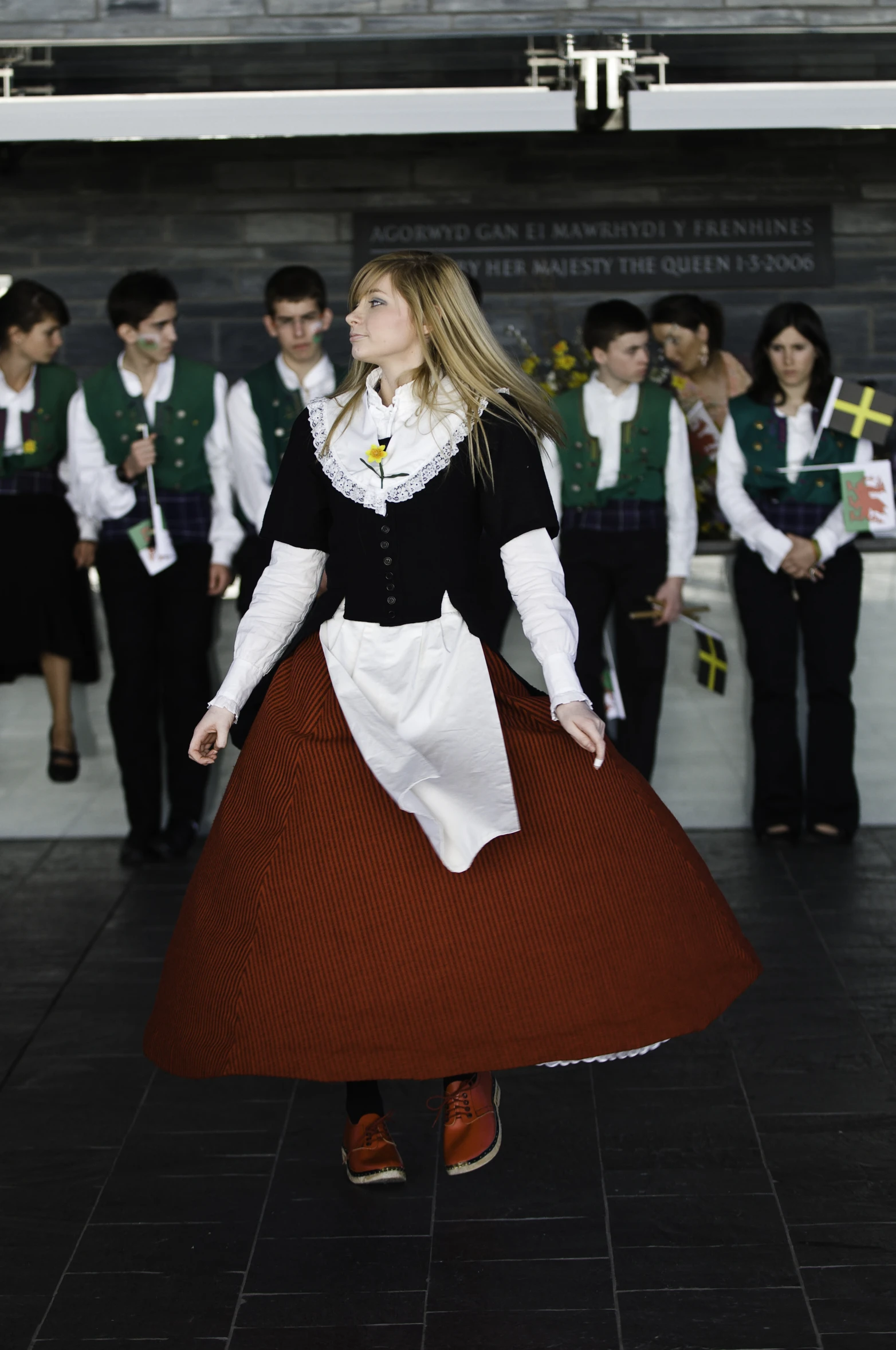 a group of people dressed in costumes are gathered