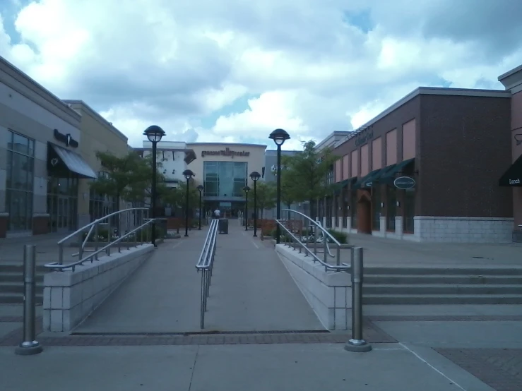 a street that has some stairs and lights on it