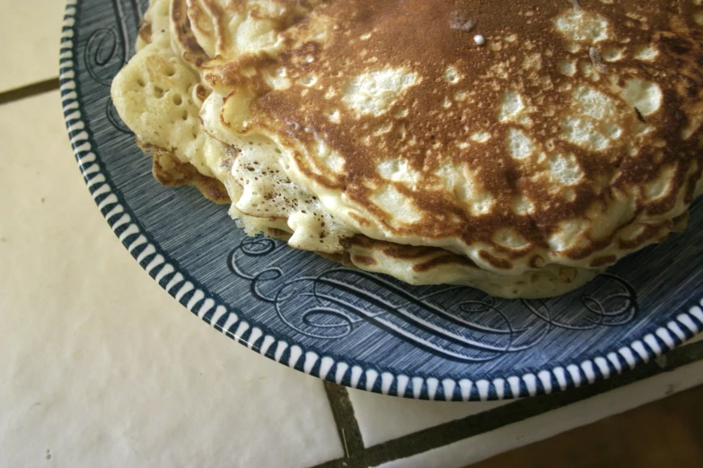 a plate with several pancakes stacked on top of each other