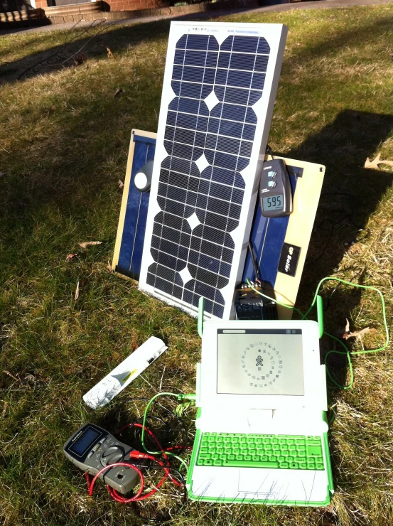 some electronics are laying out in the grass