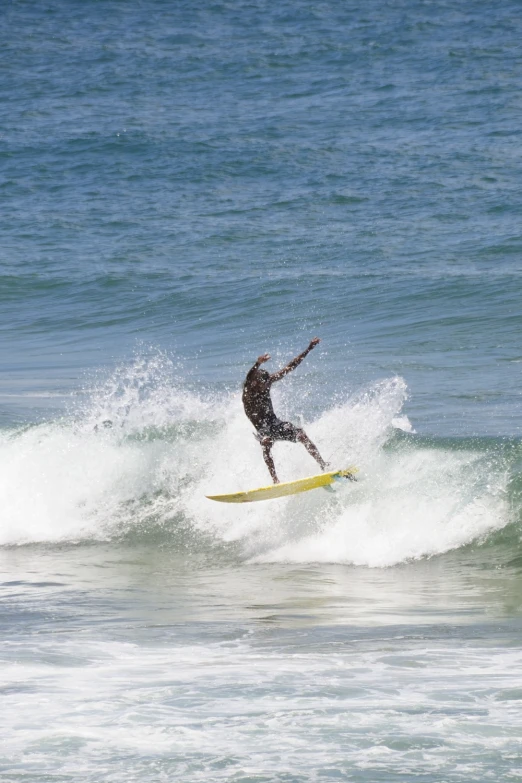 a man is surfing on a white surfboard