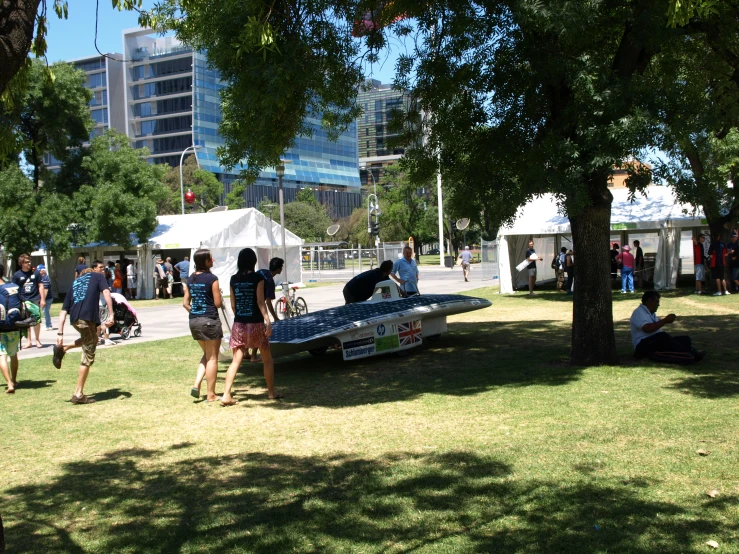 people enjoying an outdoor festival in the city