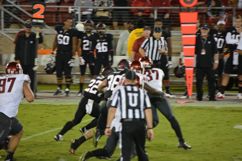 a football game with players fighting over the ball