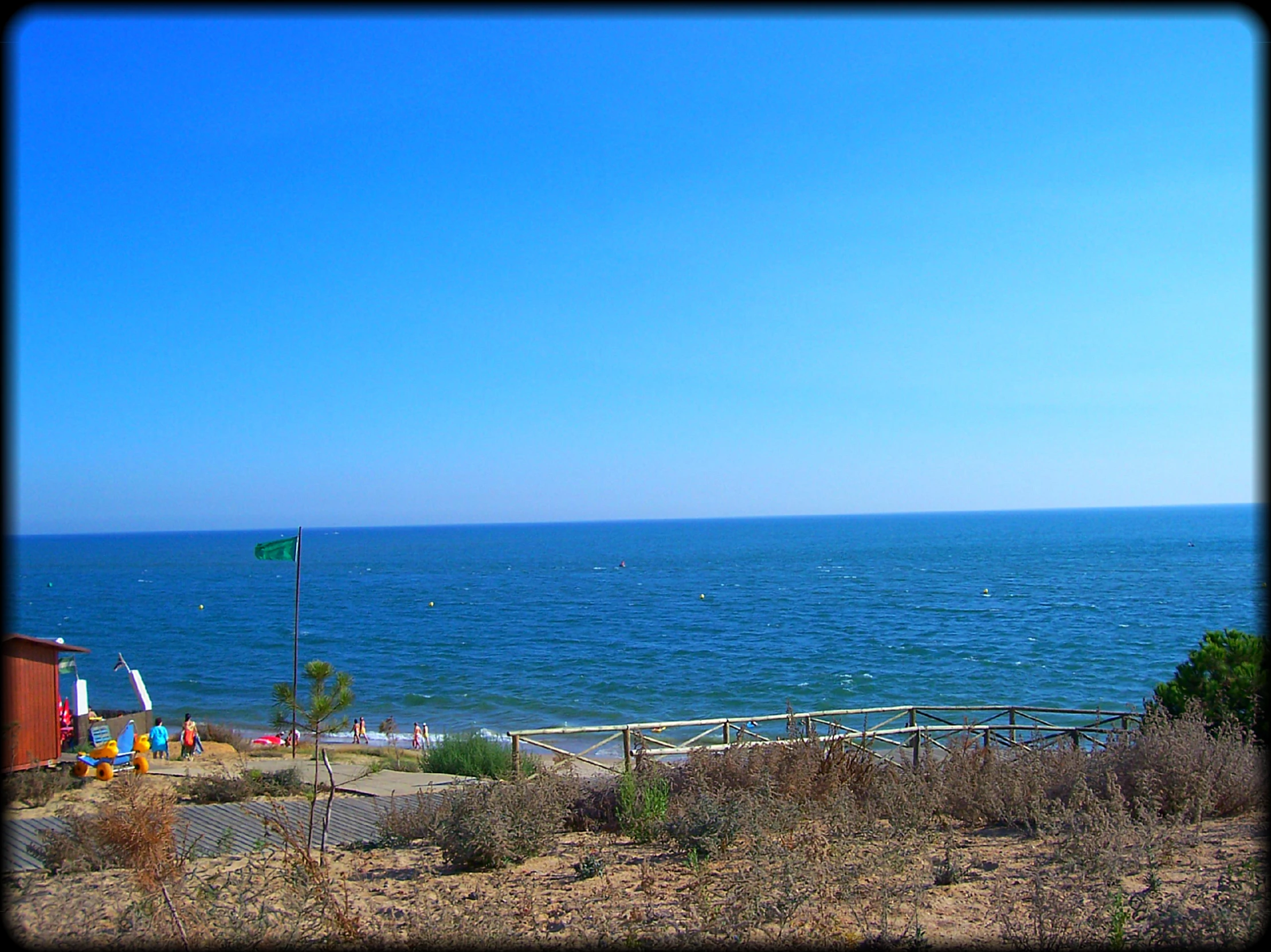 a pier sitting next to a blue body of water