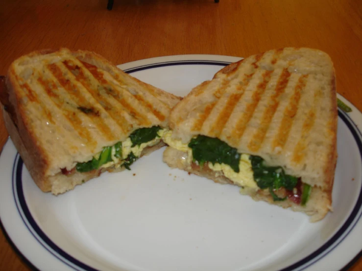 a panini has vegetables and cheese on it