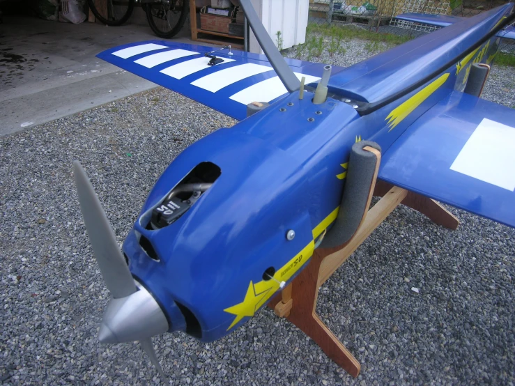 a toy airplane with yellow stars and stripes