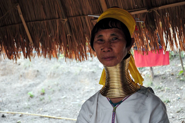 an old person with jewelry on their neck and neck