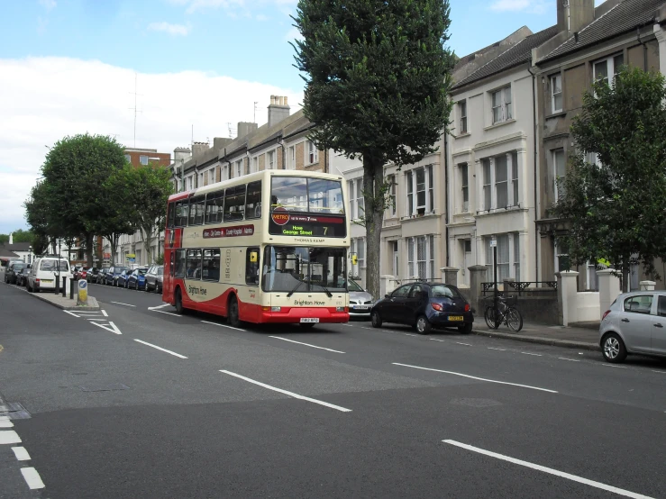 a double decker bus is parked on the side of the street