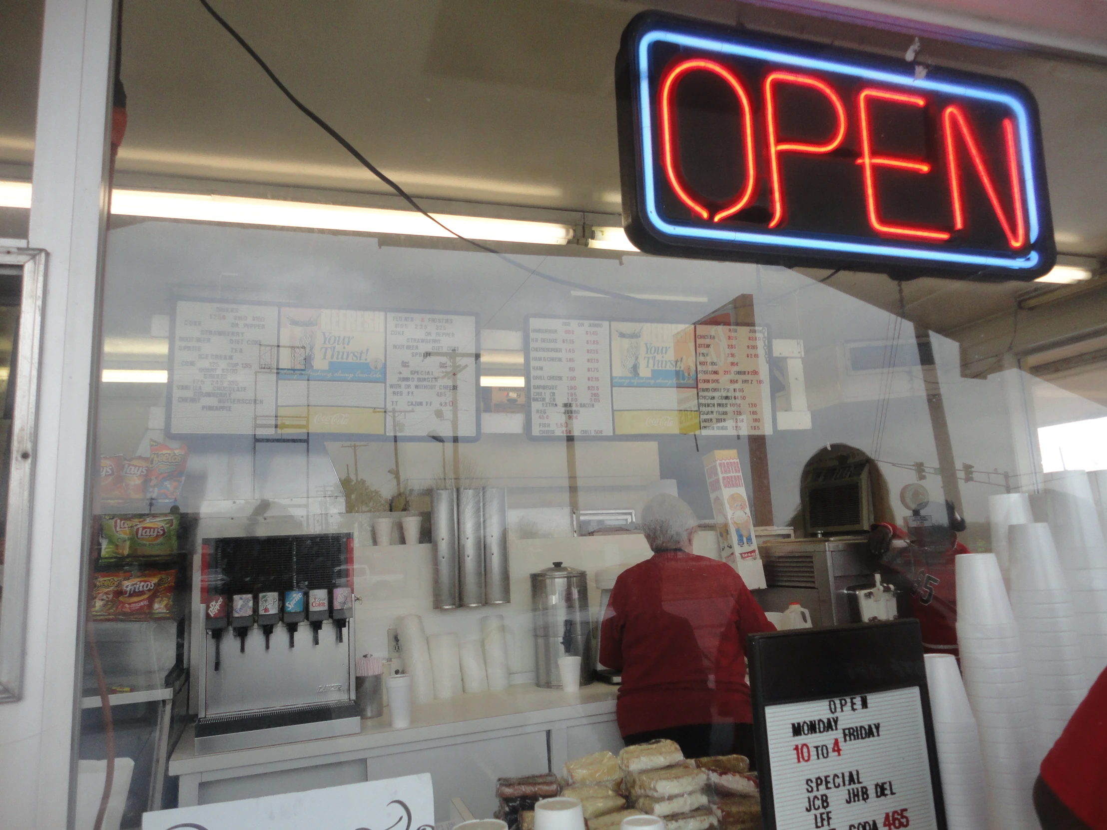 the open sign above the restaurant counter