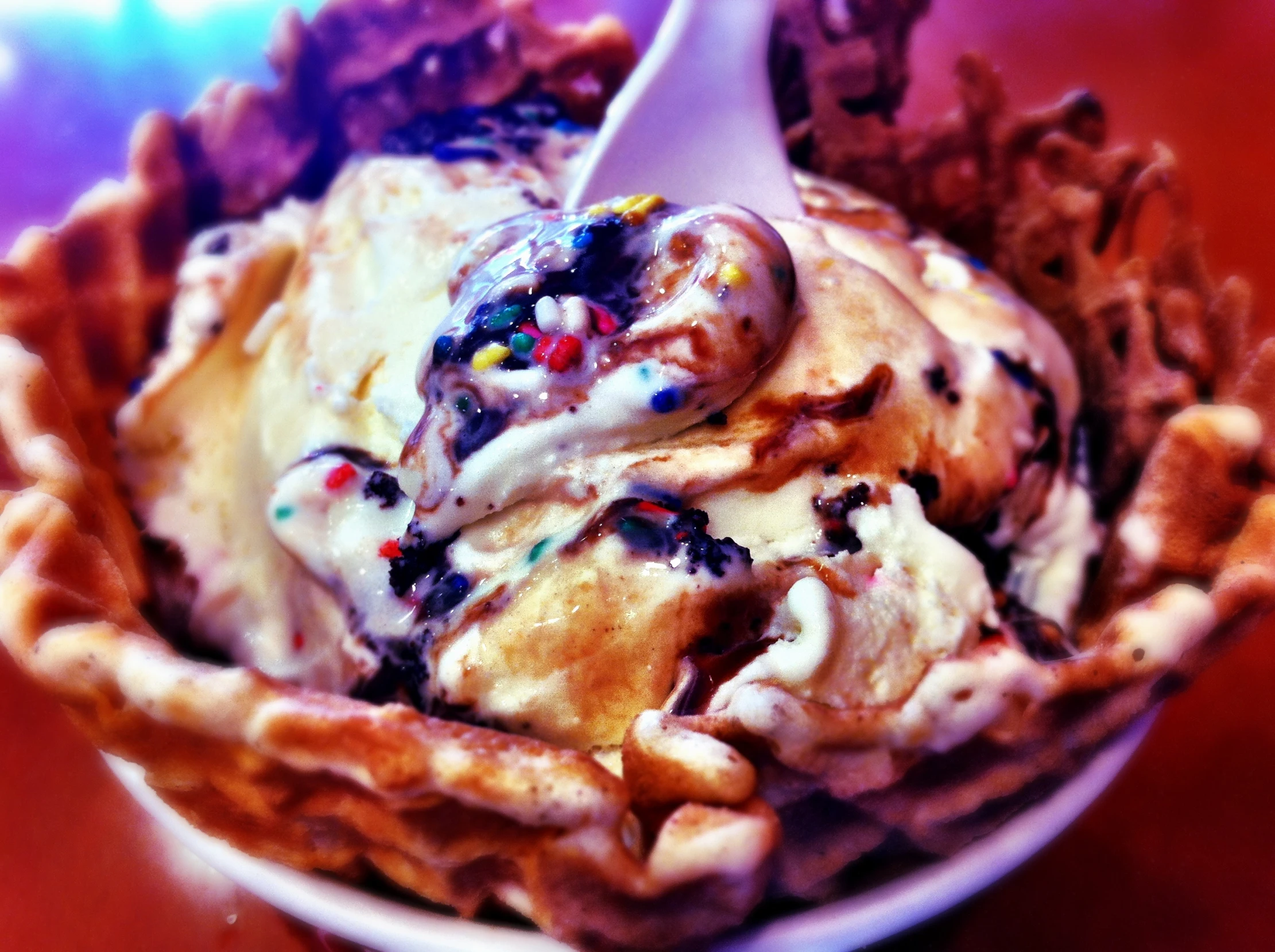 an ice cream bowl filled with an elaborate swirl in the center