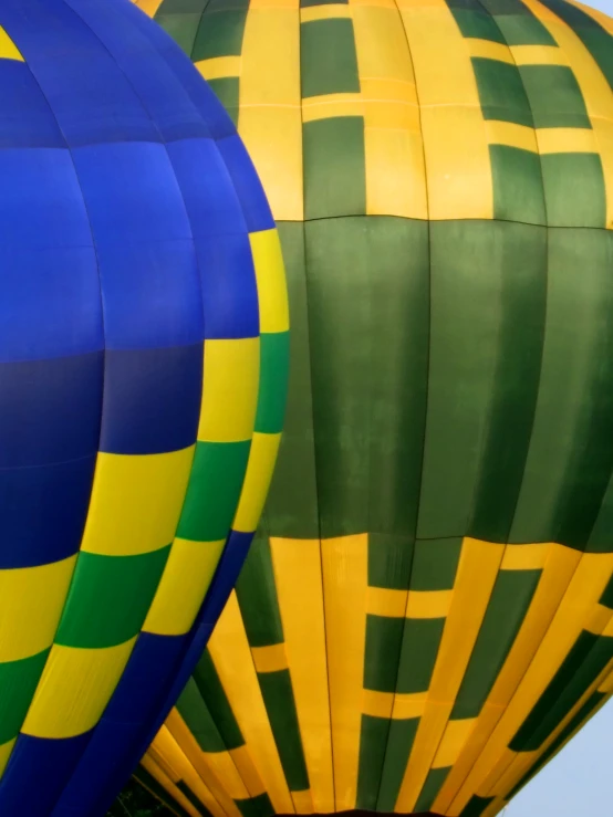 two colorful  air balloons are being inflated