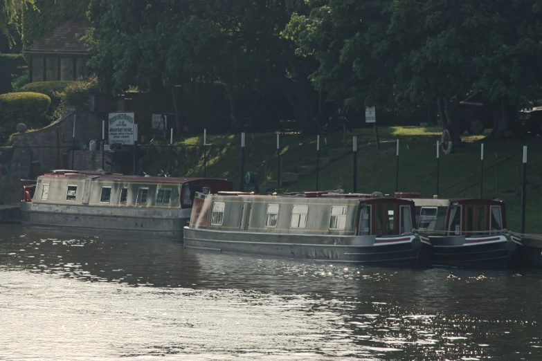 there are some tugboats sailing down the river