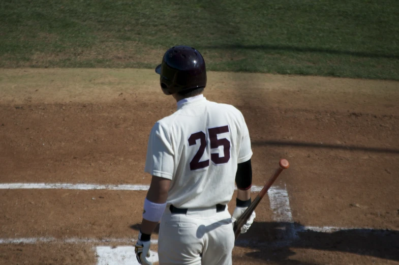 a baseball player standing next to home plate