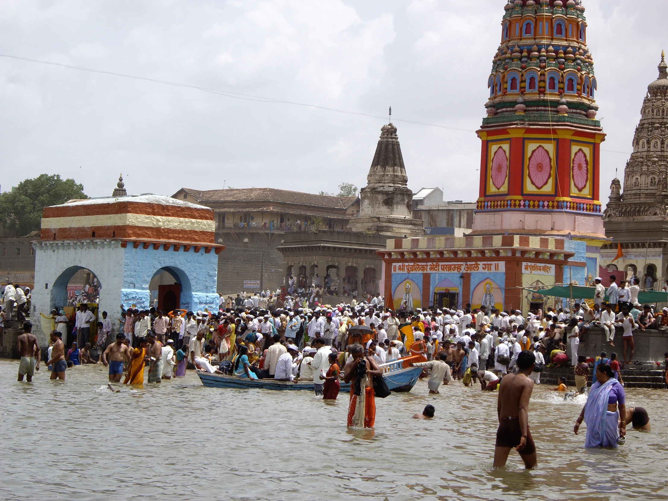 several people are gathering in a flooded area