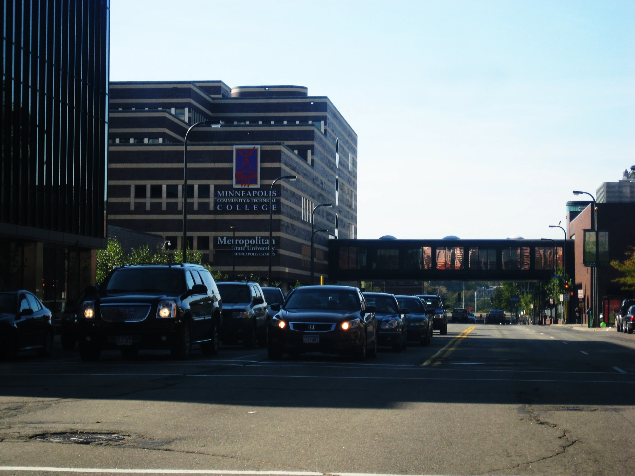 many cars parked in front of buildings on the street