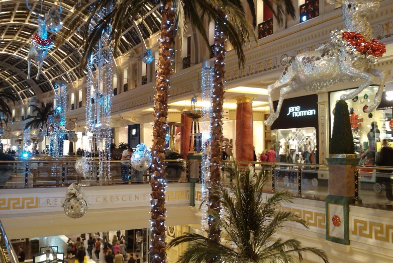 this is a view of an upscale shopping mall with palm trees