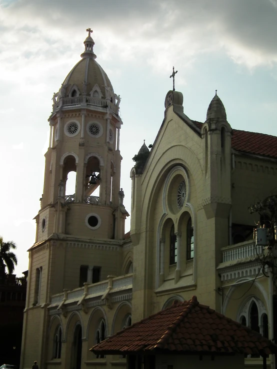 a church with a bell tower and a tiled roof