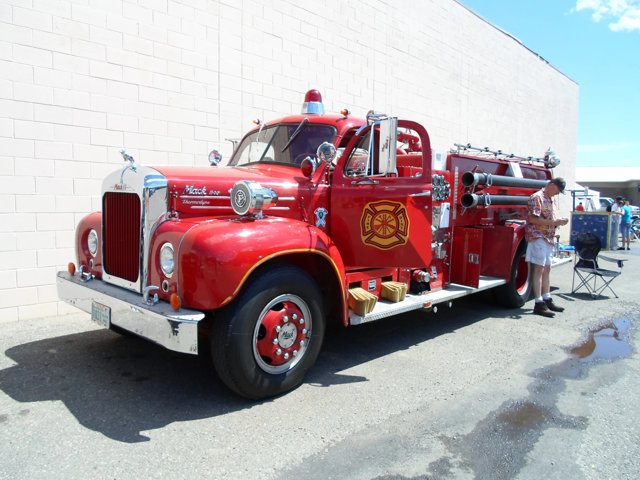 an old fire truck is parked on the side of the road