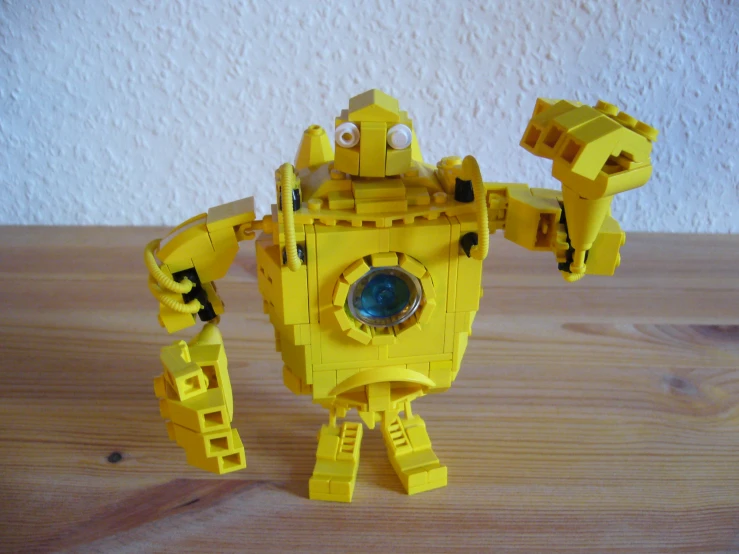 the action figure made out of lego is yellow