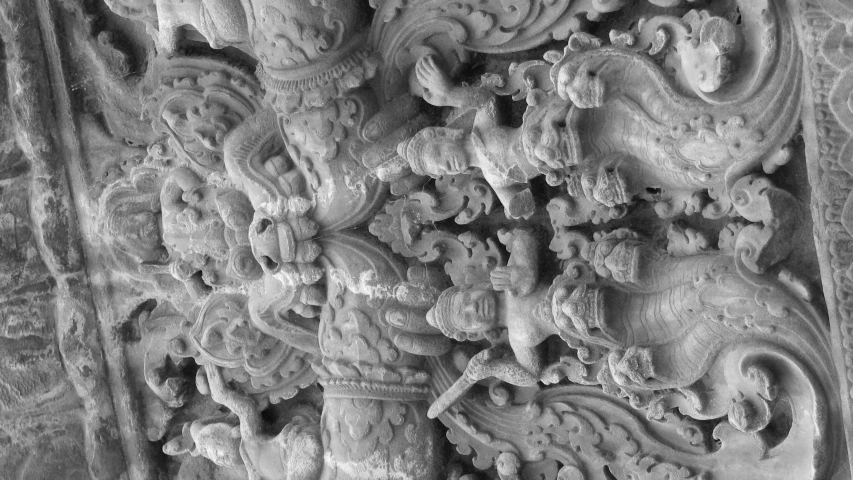 an ornate carved panel in black and white