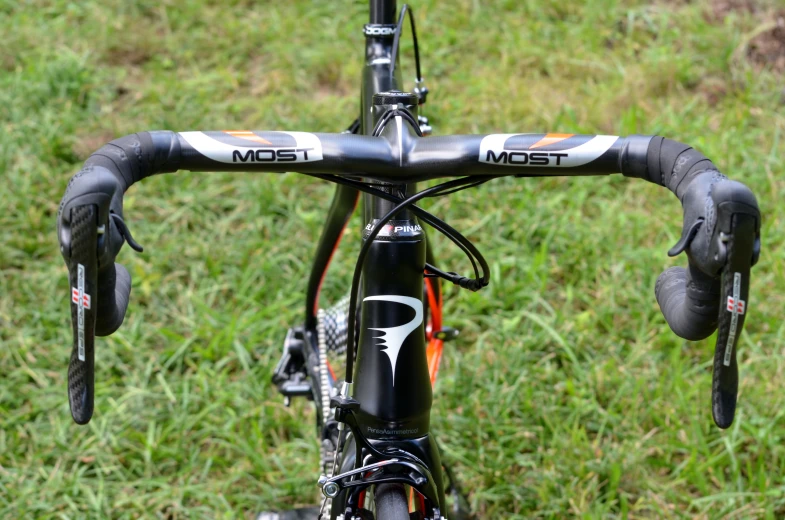 a black and silver bike parked on a field