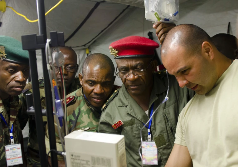 an african american man looks at some equipment on display