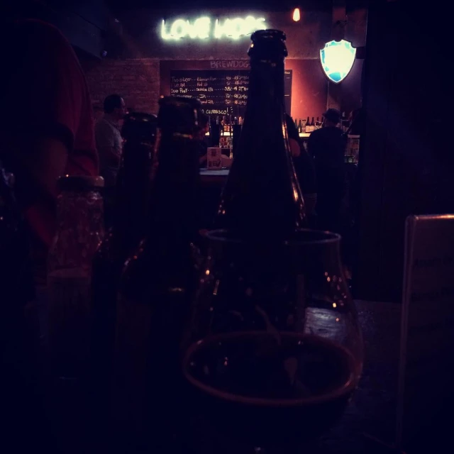 a group of bottles sitting on top of a bar