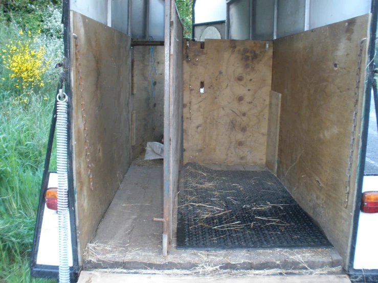 a view inside an enclosed vehicle in a field