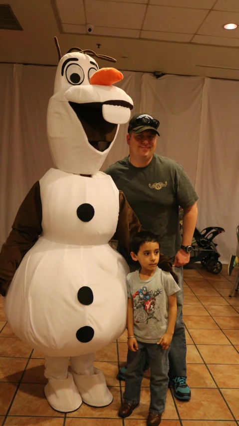 a group of people posing with large stuffed animals