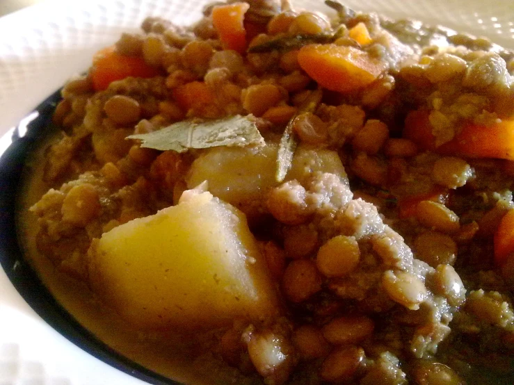 a plate filled with meat, vegetables and potatoes