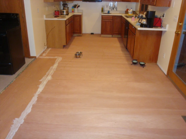 a kitchen with the floor removed to make a room for some other people