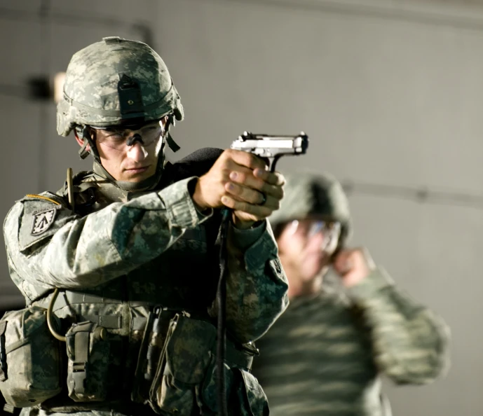 two soldiers with the rifles on in a room